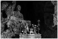 Altar and Buddha statue in cave. Da Nang, Vietnam ( black and white)