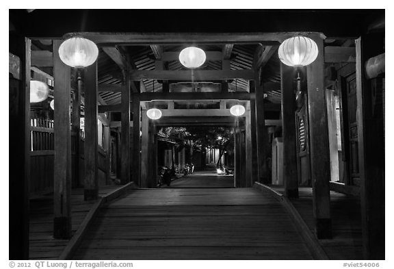 View through the inside of Covered Japanese Bridge at night. Hoi An, Vietnam (black and white)