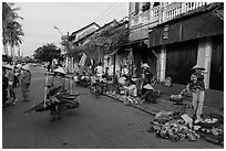 Fruit and vegetable vendors in old town. Hoi An, Vietnam (black and white)