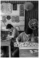 Wood carving workshop. Hoi An, Vietnam (black and white)