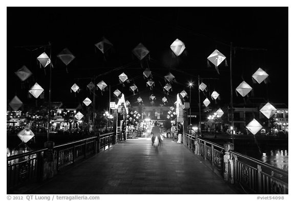 Cam Nam bridge with lighted lanterns at night. Hoi An, Vietnam (black and white)