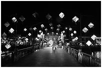 Cam Nam bridge with lighted lanterns at night. Hoi An, Vietnam ( black and white)
