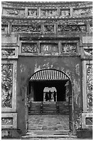 Palace and silhouettes seen from doorway, citadel. Hue, Vietnam ( black and white)