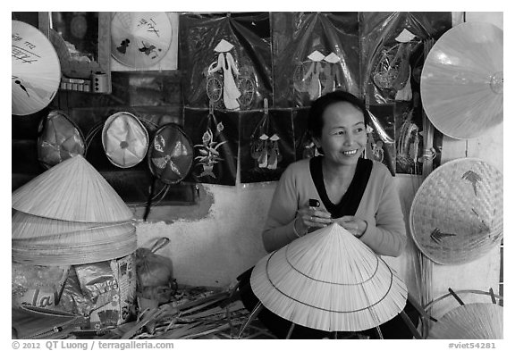 Woman in hat-making workshop. Hue, Vietnam (black and white)