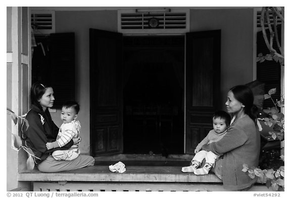 Mothers and infants on porch, Thanh Toan. Hue, Vietnam (black and white)