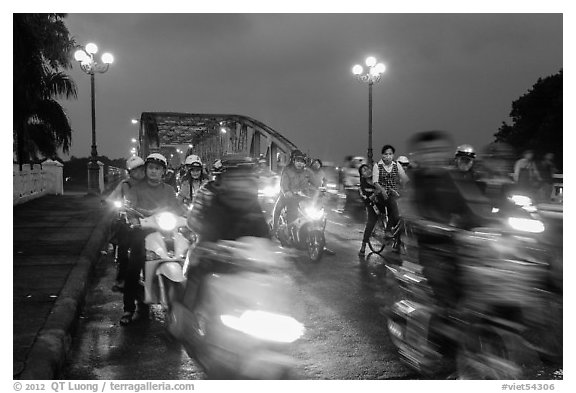 Night motorcyle traffic out of Trang Tien bridge. Hue, Vietnam