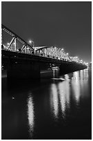 Trang Tien Bridge lights reflected in Perfume River. Hue, Vietnam ( black and white)
