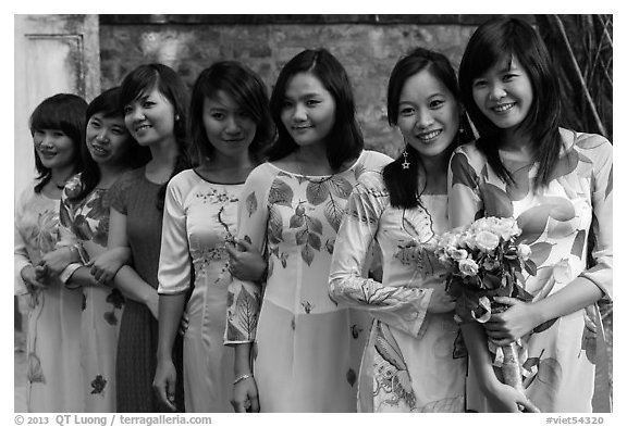 Row of women in Ao Dai, Temple of the Litterature. Hanoi, Vietnam (black and white)