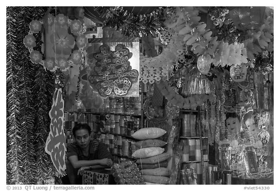 Store selling traditional party decorations, old quarter. Hanoi, Vietnam (black and white)