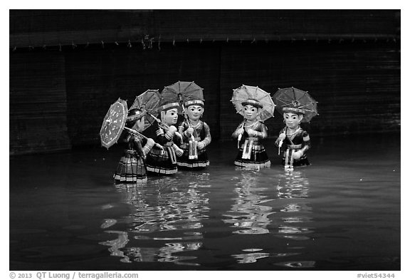 Water puppets (5 characters with umbrellas), Thang Long Theatre. Hanoi, Vietnam (black and white)