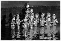 Water puppets (14 characters with lotus), Thang Long Theatre. Hanoi, Vietnam (black and white)