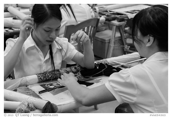 Women in silk embroidery factory. Vietnam (black and white)