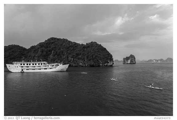 Tour boat and sea kayaks. Halong Bay, Vietnam (black and white)