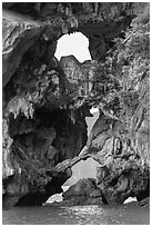 Openings through rocks. Halong Bay, Vietnam (black and white)