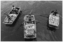 Women selling sea shells and perls from row boats. Halong Bay, Vietnam (black and white)