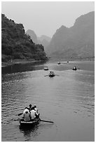 Boats in karstic lanscape of steep cliffs, Trang An. Ninh Binh,  Vietnam ( black and white)