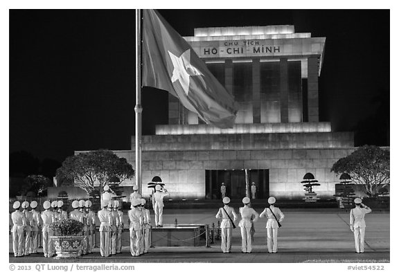 Lowering of flag in front of Ho Chi Minh Mausoleum at night. Hanoi, Vietnam (black and white)