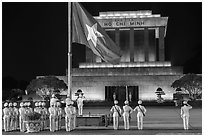 Lowering of flag in front of Ho Chi Minh Mausoleum at night. Hanoi, Vietnam ( black and white)