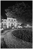 Public garden and library building at night. Hanoi, Vietnam (black and white)