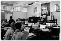 Monks working on computers, An Quang Pagoda, district 10. Ho Chi Minh City, Vietnam (black and white)