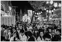 Street filled with crowds on Christmas eve. Ho Chi Minh City, Vietnam (black and white)