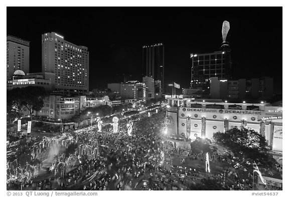 Crowded intersection at night from above, during holidays. Ho Chi Minh City, Vietnam (black and white)