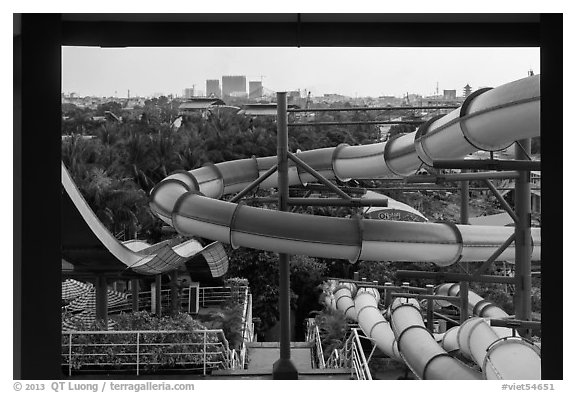 Water slides and skylines, Dam Sen Water Park, district 11. Ho Chi Minh City, Vietnam (black and white)