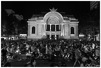 Crowds in front of Opera House at night. Ho Chi Minh City, Vietnam (black and white)