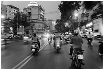 View from middle of street traffic at dusk. Ho Chi Minh City, Vietnam (black and white)