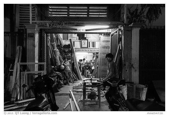 Frame shop at night. Ho Chi Minh City, Vietnam (black and white)