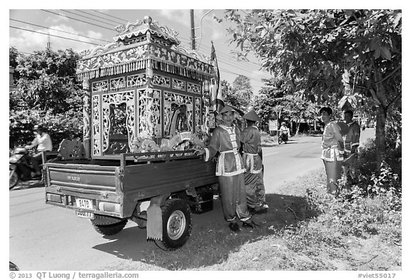 Funeral vehicle and attendants. Tra Vinh, Vietnam