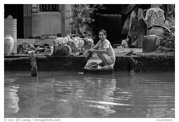 Woman laudering at the river. Can Tho, Vietnam (black and white)