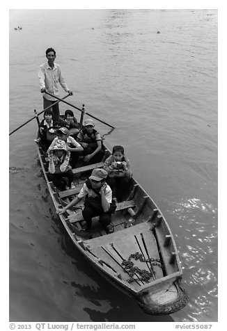 Schoolchildren rowed by parent. Can Tho, Vietnam (black and white)