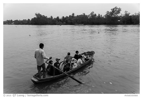 Schoolchildren crossing river on boat. Can Tho, Vietnam