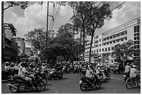 Motorcycle traffic near University of Medicine. Cholon, Ho Chi Minh City, Vietnam ( black and white)