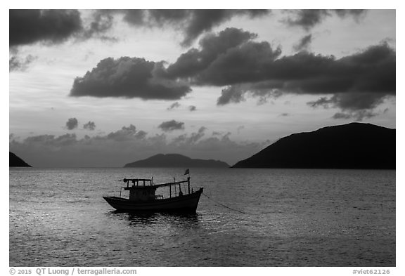 Fishing boat and Con Son Bay, sunrise. Con Dao Islands, Vietnam (black and white)