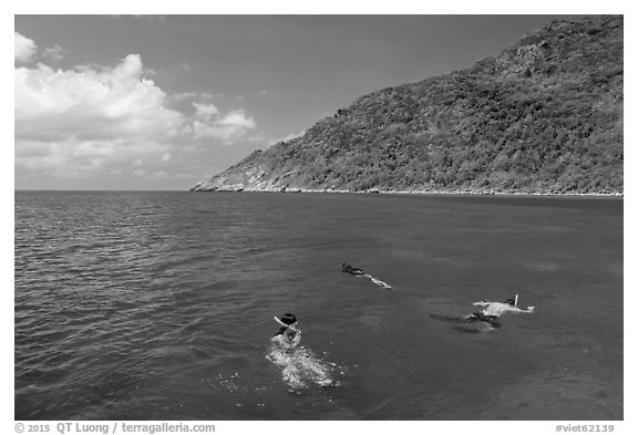 Snorklers near Bay Canh Island, Con Dao National Park. Con Dao Islands, Vietnam (black and white)