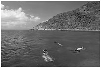 Snorklers near Bay Canh Island, Con Dao National Park. Con Dao Islands, Vietnam ( black and white)