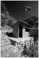 Entrance booth with Vietnam flag, Bay Canh Island, Con Dao National Park. Con Dao Islands, Vietnam ( black and white)