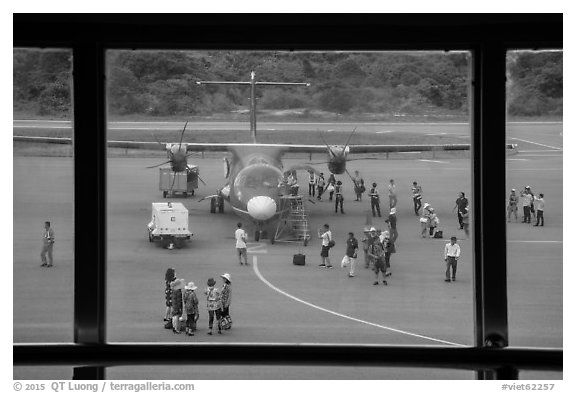 Airport tarmac with just deplaned passengers. Con Dao Islands, Vietnam (black and white)