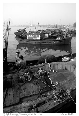 Fisherman relax in a boat, Dong Hoi. Vietnam (black and white)