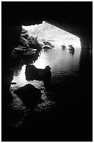 Interior and entrance of Phong Nha Cave with Rocks and boats. Vietnam (black and white)