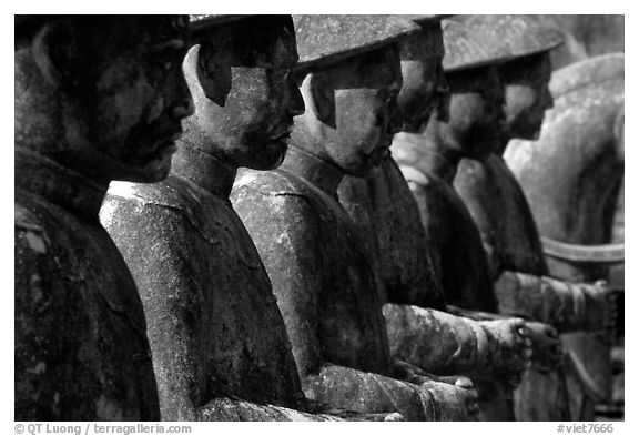 Row of statues in Khai Dinh Mausoleum. Hue, Vietnam (black and white)