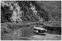 Shallow boats transport villagers to a market. Northeast Vietnam ( black and white)