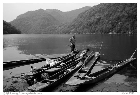 Dugout boats on the shore of Ba Be Lake. Northeast Vietnam (black and white)