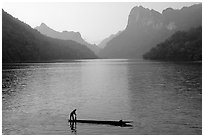Fisherman on Dugout boat,  Ba Be Lake. Northeast Vietnam (black and white)