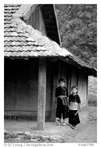 Two Hmong boys outside their house in Xa Linh village. Northwest Vietnam (black and white)