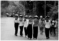 Young thai women walking on the road, between Son La and Tuan Chau. Northwest Vietnam ( black and white)