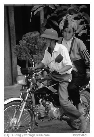 Dzao woman riding at the back of a motorbike, Tuan Giao. Northwest Vietnam (black and white)