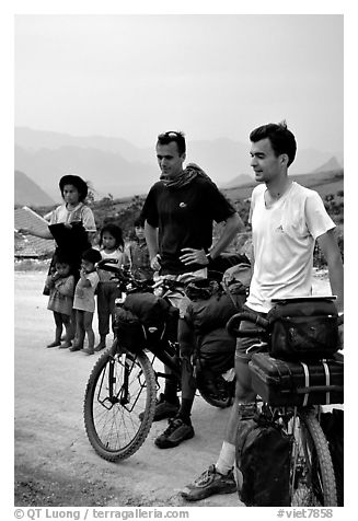Western adventure travellers on mountain bikes, near Tam Duong. Northwest Vietnam